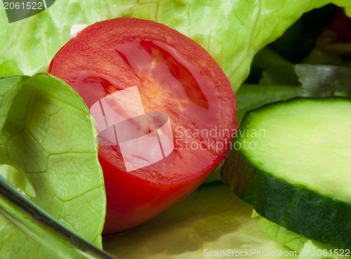 Image of Salad in a glass bowl close up. 