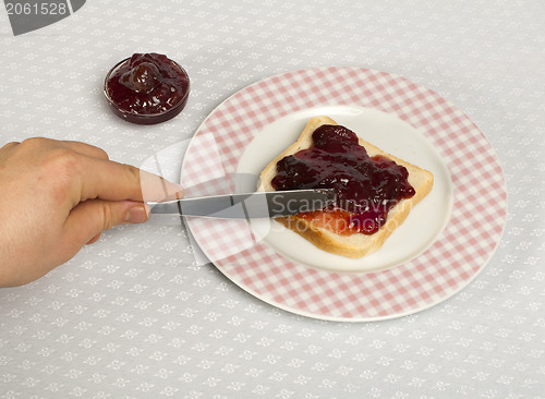 Image of Spread jam on bread