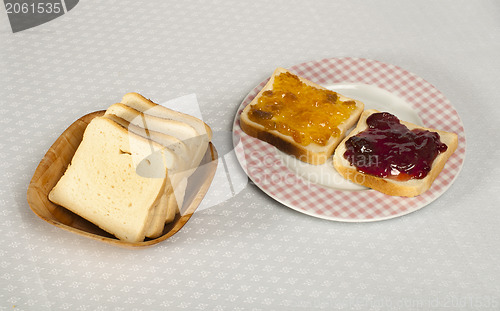 Image of Spread jam on bread