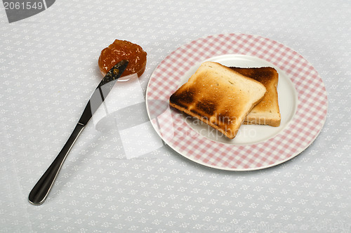 Image of Slice of bread spread with jam