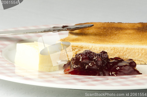 Image of Jam, butter and toast.
