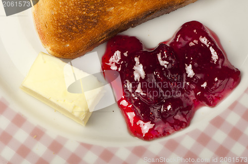 Image of Jam, butter and toast.