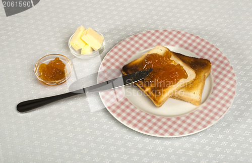 Image of Spread jam on bread