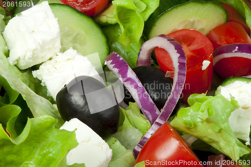 Image of Salad in a glass bowl close up. 