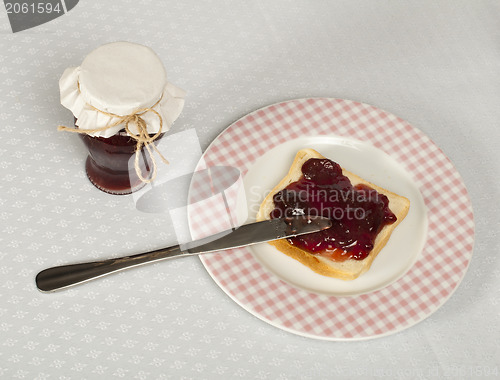 Image of Spread jam on bread
