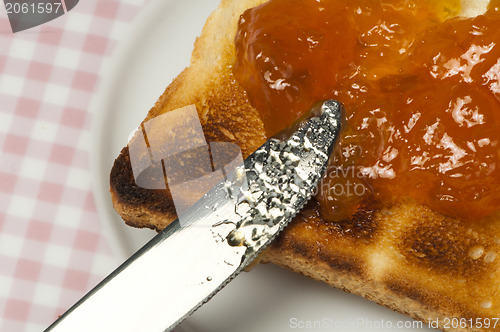 Image of Spread jam on bread