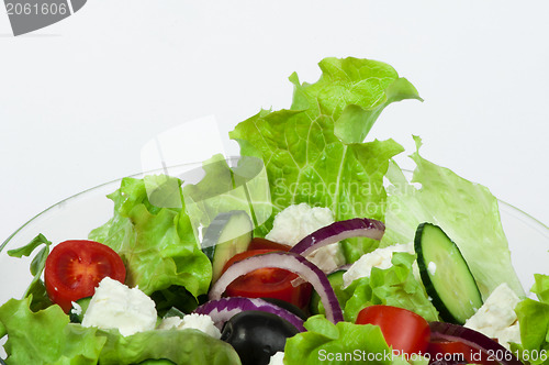 Image of Salad in a glass bowl close up