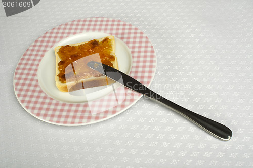 Image of Spread jam on bread