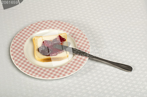Image of Spread jam on bread
