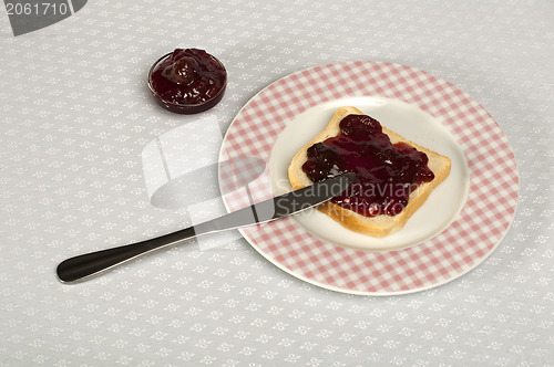 Image of Spread jam on bread