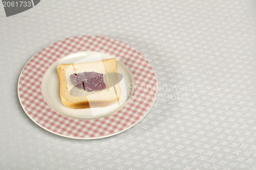 Image of Spread jam on bread