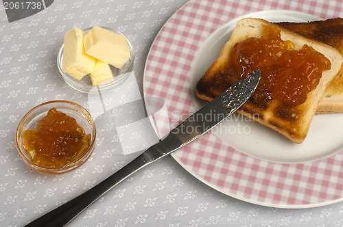 Image of Spread jam on bread