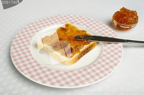 Image of Spread jam on bread