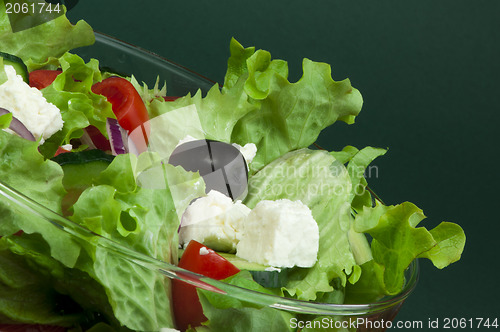 Image of Salad in a glass bowl close up. 