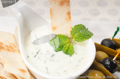 Image of Greek Tzatziki yogurt dip and pita bread