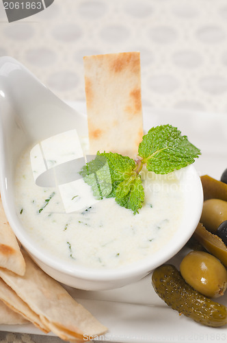 Image of Greek Tzatziki yogurt dip and pita bread