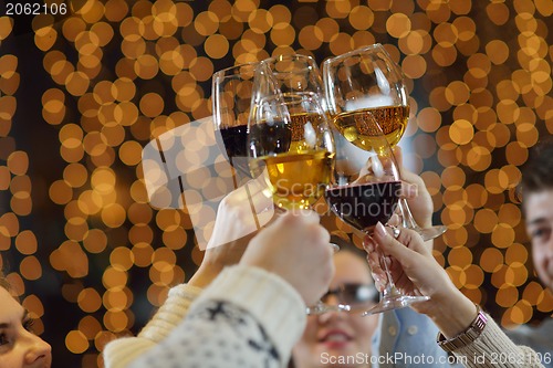 Image of Hands holding the glasses of champagne and wine