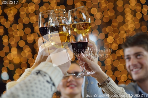 Image of Hands holding the glasses of champagne and wine