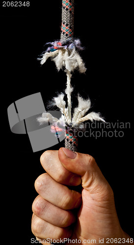 Image of Hand on breaking rope