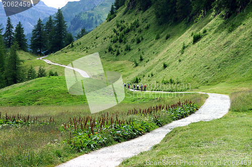 Image of People hiking and mountain landscape