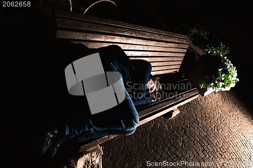 Image of Homeless girl on the bench