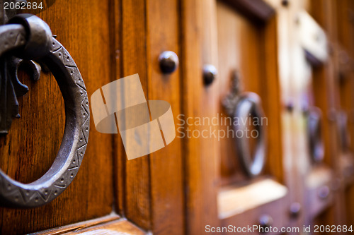 Image of Metal clapper on ancient wooden door