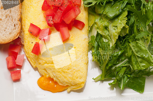 Image of cheese ometette with tomato and salad