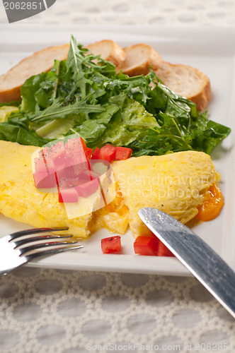 Image of cheese ometette with tomato and salad