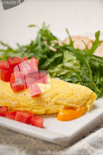 Image of cheese ometette with tomato and salad