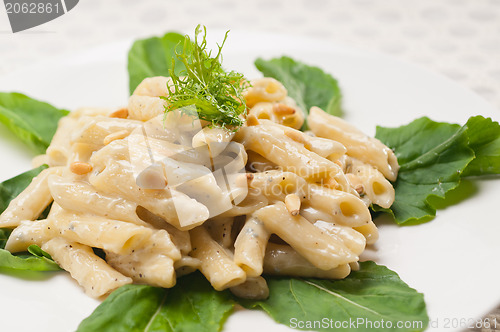 Image of Italian pasta penne gorgonzola and pine nuts