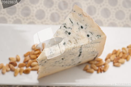 Image of gorgonzola cheese fresh cut and pinenuts