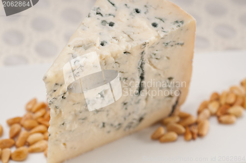 Image of gorgonzola cheese fresh cut and pinenuts