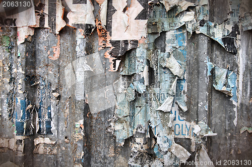 Image of Torn posters wall