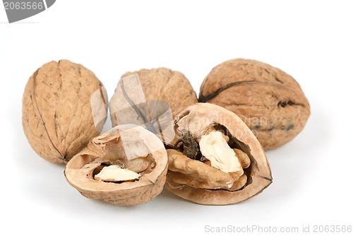 Image of walnut and a cracked walnut isolated on white background