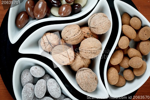 Image of detail of almonds in chocolate and walnuts