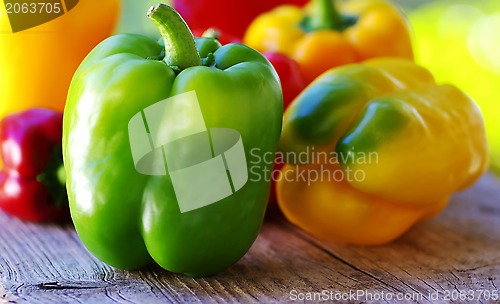 Image of yellow, red, green peppers on table