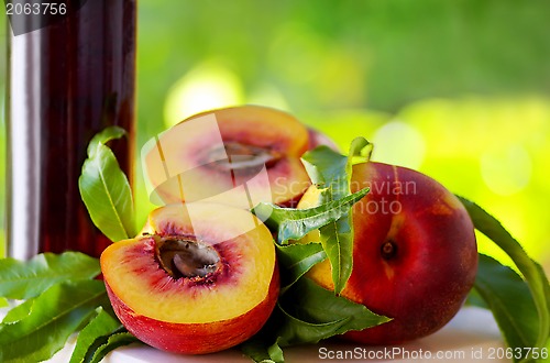 Image of Peaches and bottle of liquor