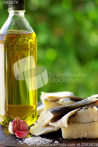 Image of Codfish, oil and garlic.