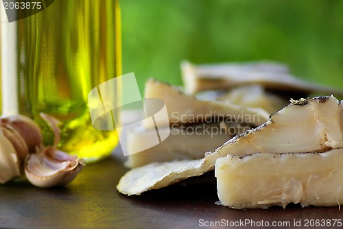 Image of Codfish, oil and garlic.