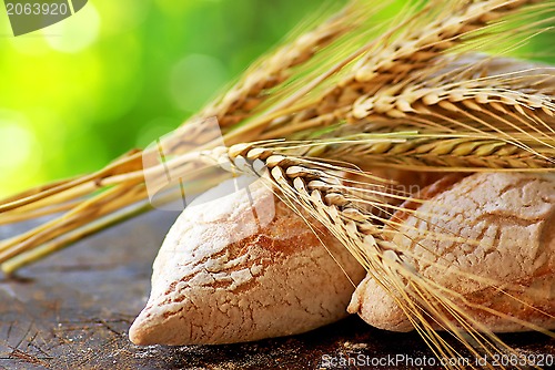 Image of Portuguese bread and  spikes of wheat.