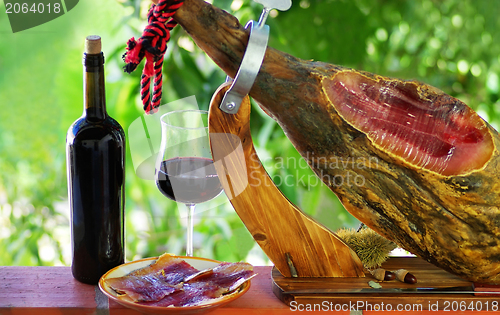 Image of Jamon of spain and red wine.