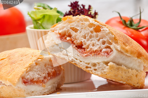 Image of ciabatta panini sandwich with parma ham and tomato