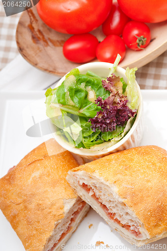 Image of ciabatta panini sandwich with parma ham and tomato