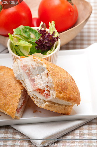 Image of ciabatta panini sandwich with parma ham and tomato