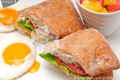 Image of ciabatta panini sandwich eggs tomato lettuce