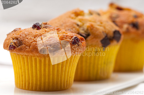 Image of fresh chocolate and raisins muffins