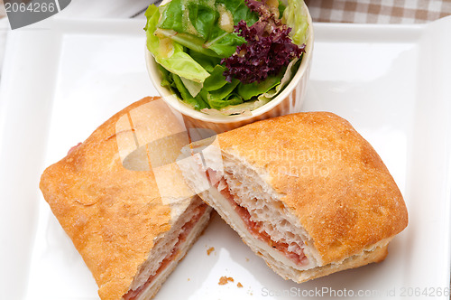 Image of ciabatta panini sandwich with parma ham and tomato