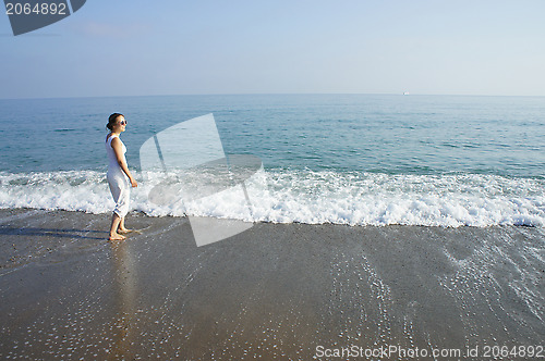 Image of Young woman on the beach