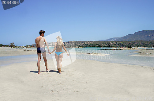 Image of Young happy couple on the beach