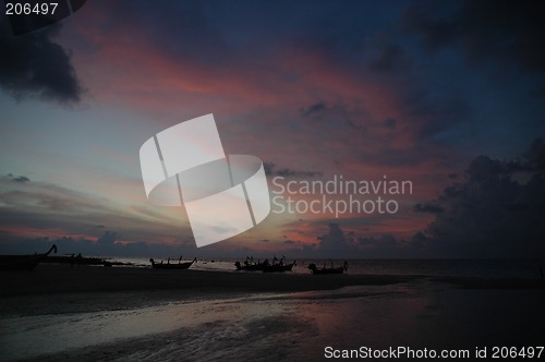 Image of Tailboats and sunset